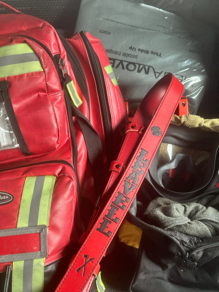 Box 31 red leather EMS bag, stamped and hand-painted in black, shown in service on red EMS bag
