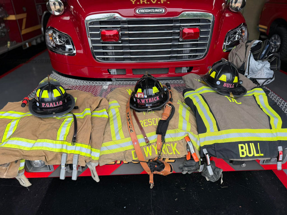 Three turnout coats are shown with a collection of Box 31 helmet bands, chin straps and radio straps, all in service in North Carolina.
