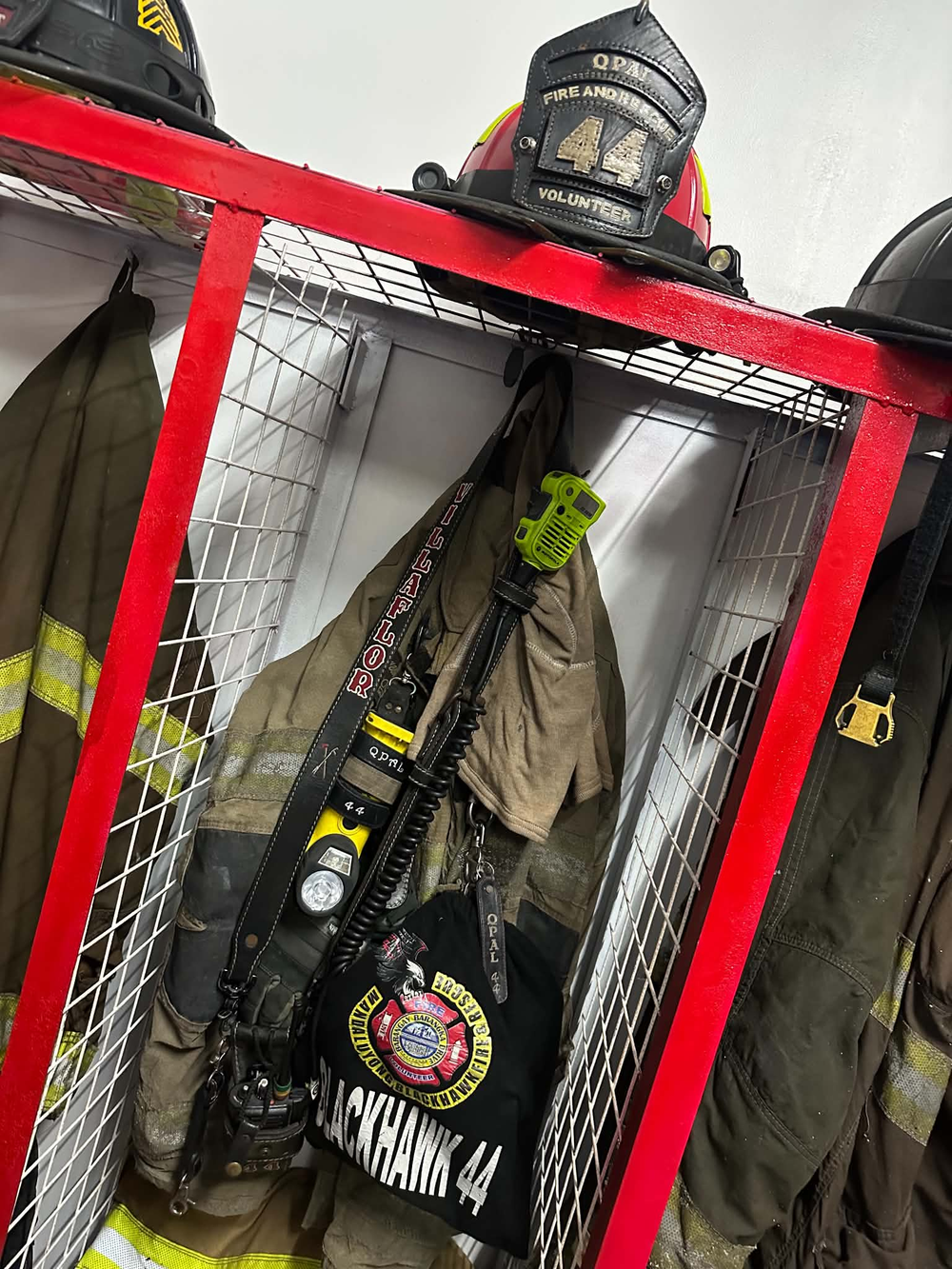 A hand-painted radio strap, black leather with red and white lettering, hangs in a gear locker. Sent in by a customer, this strap has been in service in the Philippines for seven years!