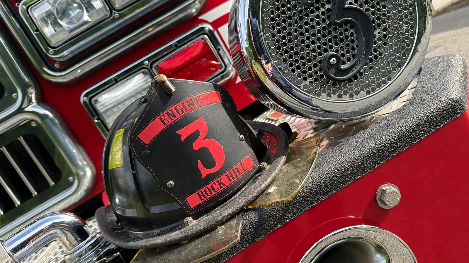 Personalized Box 31 firefighter helmet displayed on Engine 3